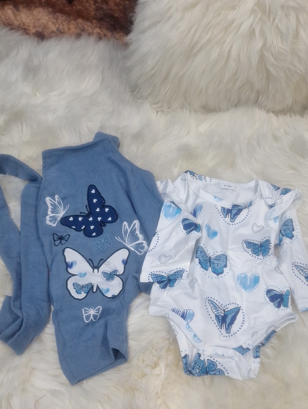 Gunia baby girl outfit set includes a blue suspender romper featuring butterfly